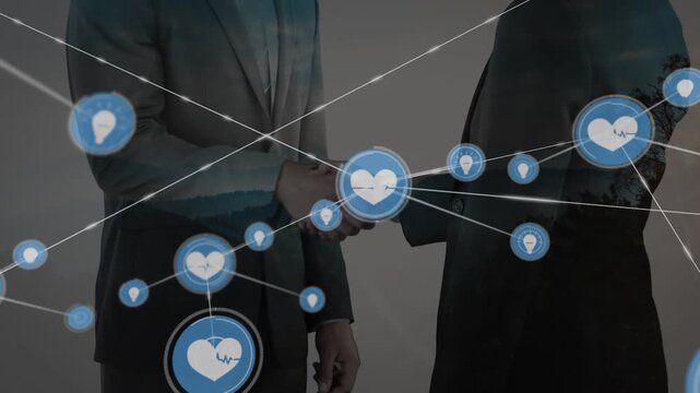 Animation of network of connections with icons over midsection of businesspeople shaking hands