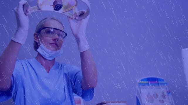 Animation of pattern and purple tint over female dentist