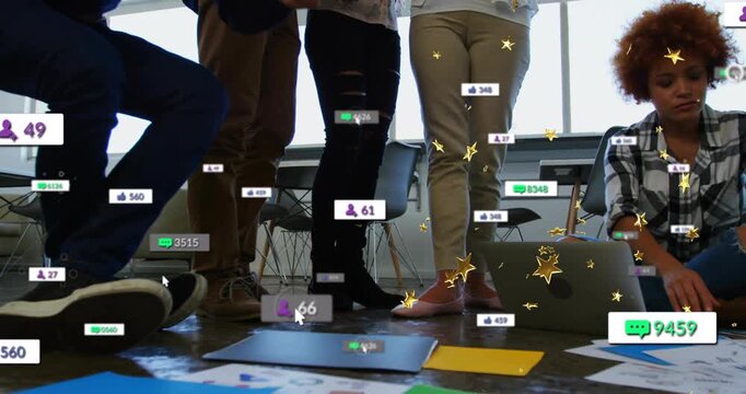 Marketing team crouching on floor papers while tablet sparking chat bubbles likes gold stars rising