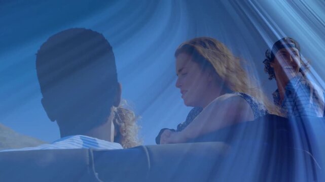 Friends leaning on railing beneath blue canopy highlighting tech design with animated light overlay