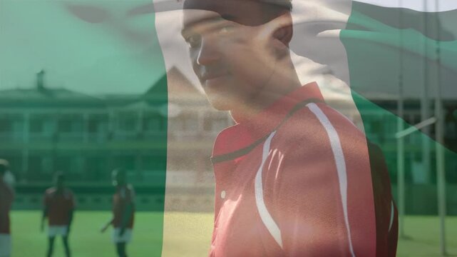 Animation of flag of peru over diverse rugby players at stadium