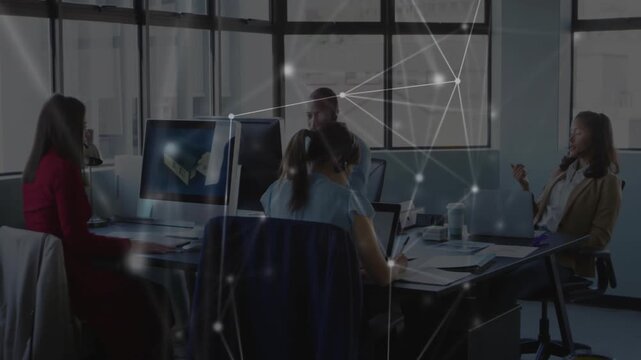 Project team discussing 3D model appearing on monitor, animated network drifting, guiding notes
