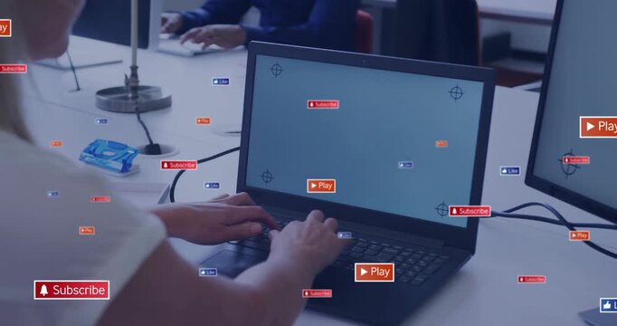 Vertical video: Woman typing on laptop, causing Play Subscribe badges spreading across desk for ads
