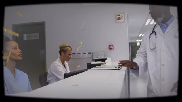 Dr walking in, leaning on clinic desk and handing files for filing while yellow overlays sweeping