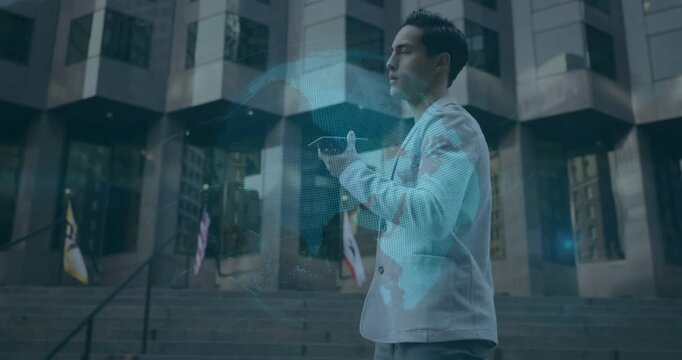 Man raising phone and gesturing on steps, activating rotating blue globe overlay for tech demo