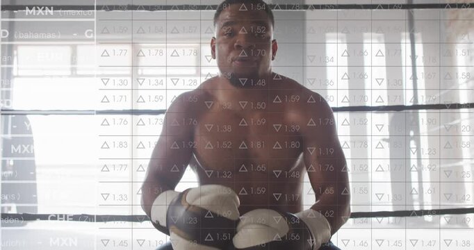 Male boxer raising bottle, breathing, regaining focus while currency overlay crossing over boxer