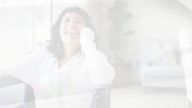 Woman sitting holding phone to ear smiling during social call while triangular wipe revealing tech
