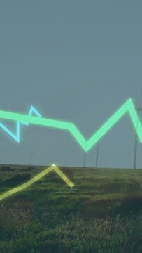 Vertical video: Neon lines emerging lower left tracing peaks above wind farm showing data