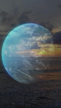 Vertical video: Faint globe rotating over ocean, sunset sweep causing glow shifts aiding design
