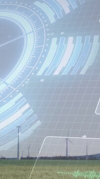 Vertical video: Wind turbines rotating in field, HUD overlay appearing from left monitoring power
