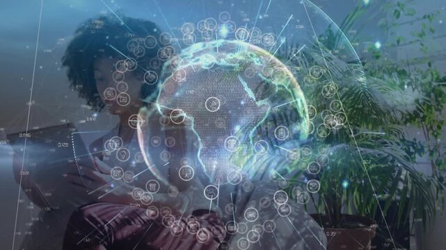 Woman tapping and swiping phone on sofa activating rotating globe overlay with icons for tech demo