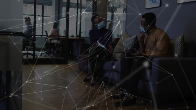 Woman unfolding documents, man reviewing project in business lobby, network overlay linking papers