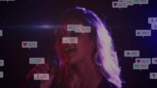 Cam pulling back, singer holding mic, icons appearing, drifting around face while singing for music