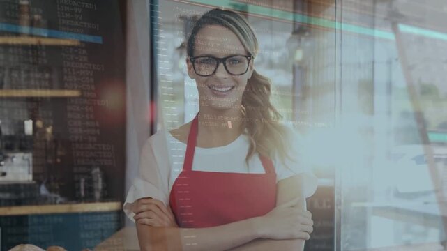 Cafe owner in apron smiling behind counter rising sun causing code overlays over torso for promo