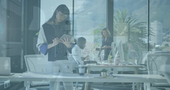 Vertical video: Standing woman tapping tablet, showing glass charts while office team sharing docs