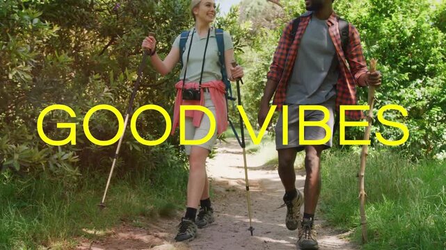 Vertical video: Hiking pair with poles, staff loving walk on trail bars sweeping causing GOOD VIBES