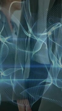 Vertical video: Woman by door adjusting phone as blue mesh pulsing and revealing face for business