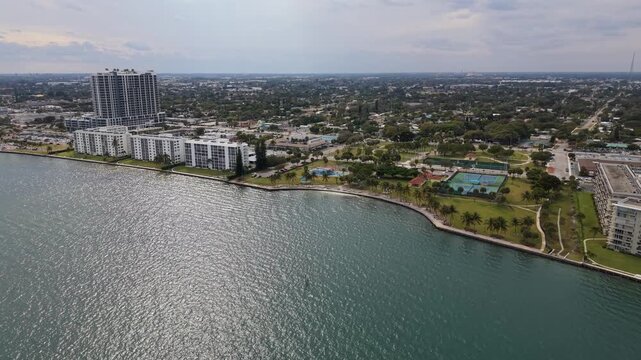 Drone shot flying west toward the Kelsey Park playground in Lake Park Florida located across the ICW from Singer Island and Riviera Beach Florida in Palm Beach County