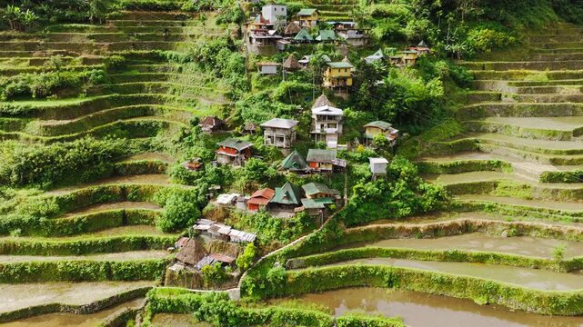 Drone slowly pulls back revealing Batad village among rice terraces Philippines