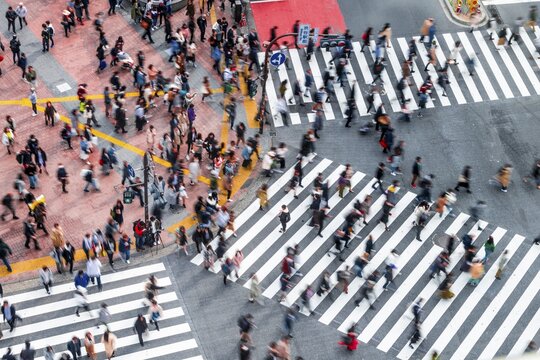 Shibuya crossing, crowds at intersection, many pedestrians cross zebra crossing, blurred, motion, Shibuya, Udagawacho, Tokyo, Japan