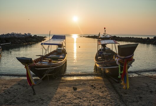 Two boats on the beach at the ocean at sunset, Koh Samui, Gulf of Thailand, Thailand