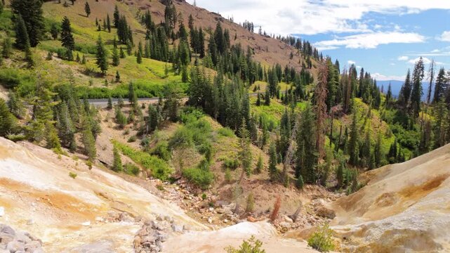 Sulfur springs emitting steam on bright day at Lassen Volcanic National Park, California, United States