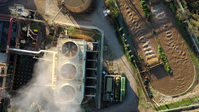 Aerial view of the industrial manufacturing complex at Wissington UK with smoke billowing from stacks above the sugar beet processing production line.