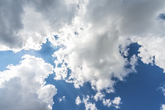 Large white clouds against a blue sky