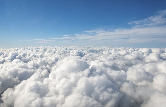 View over the clouds, cloudy sky, fleecy clouds, aerial view from airplane, New Zealand