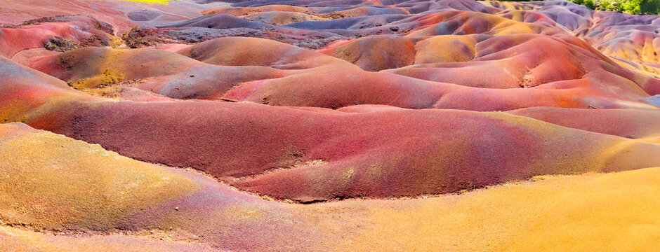 Chamarel Seven Colored Earth Geopark in Mauritius Island. Colorful panoramic landscape about this volcanic geological formation Chamarel Seven Colored Earth Geopark in Riviere noire district.