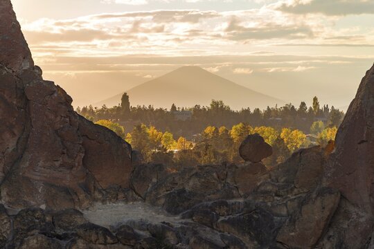 Sunset, view over rocks to Mount Mt Hood in the distance, Smith Rock State Park, Oregon, USA