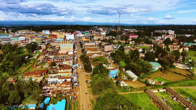Aerial flyover poor Kitale Slum and modern skyline of Kitale rural urban area of kenya during sunny day. Two class society in Africa.