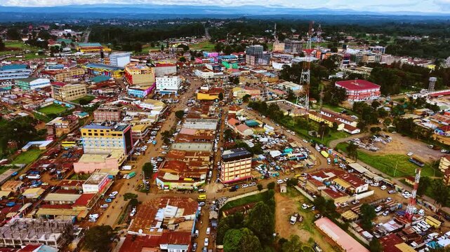 Aerial flyover poor Kitale Slum and modern skyline of Kitale rural urban area of kenya during sunny day. Two class society in Africa.