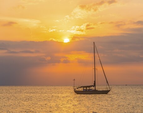 Sunrise, sailboat in the sea, Lovina Beach, Bali, Indonesia