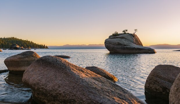 Bonsai Rock, small tree on a rock in the water, sunset, Lake Tahoe, California, USA