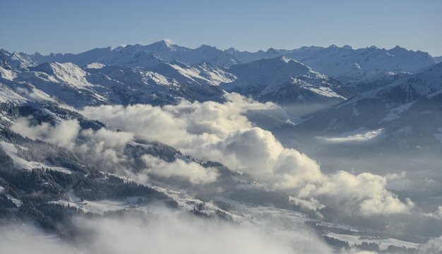 View from the Hohe Salve to the Windautal, mountain panorama in winter, cloudy valley, ski area SkiWelt Wilder Kaiser Brixental, Brixen im Thale, Tyrol, Austria