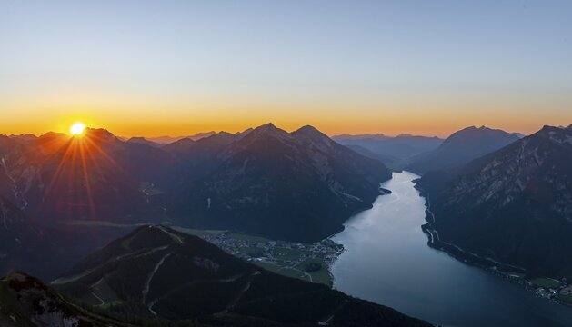 Last rays of sun over mountain landscape at sunset, view from summit of B&auml;renkopf to Achensee and summits Seebergspitze and Seekarspitze, panorama, Tyrol, Austria