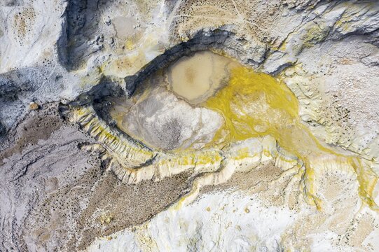 Aerial view, volcano caldera with pumice fields, yellow colored sulphur stones, Polyvotis and Alexandros craters, Nisyros, Dodecanese, Greece