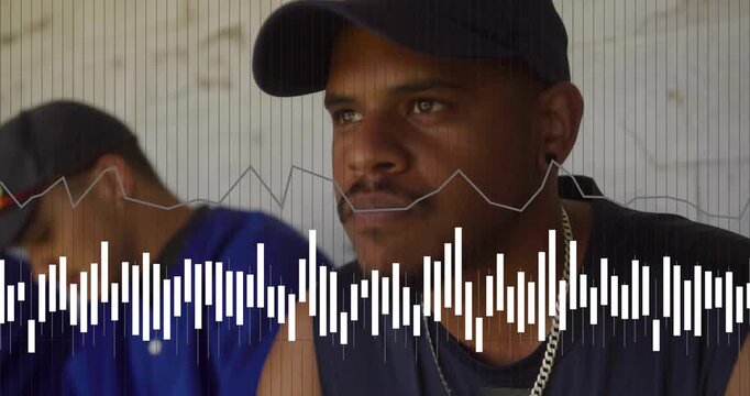 Front man sitting watching offframe while teammate shifting, audio cue starting waveform for sports