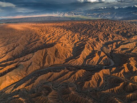 Evening atmosphere, Mountain peaks of the Tien Shan Mountains, Dramatic barren landscape of eroded hills, Badlands, Canyon of the Forgotten Rivers, Issyk Kul, Kyrgyzstan