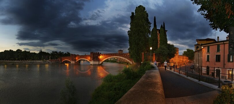 River Adige with the stone bridge Ponte Scaligero at sunset, Verona, Veneto, Italy