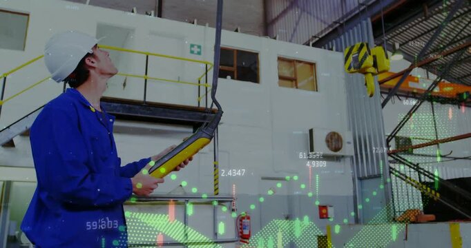 Male operator using pendant in factory, causing AR graphs syncing crane hook move and checking load