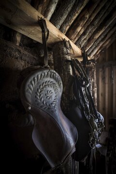 Old decorated saddle and bridle in horse stable in original peat construction, L&yacute;tingssta&eth;ir, North Iceland, Iceland