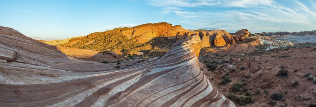 Fire Wave sandstone formation in evening light, behind Sleeping Lizard rock formation, Valley of Fire State Park, Nevada, USA