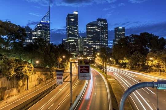 Time exposure, highway, skyscrapers at night, Sydney, New South Wales, Australia