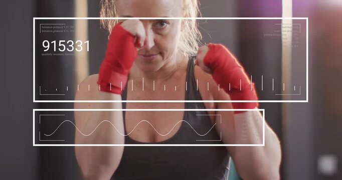 Female athlete shadow-boxing for fitness, camera rising while HUD showing numeric waveform tracking