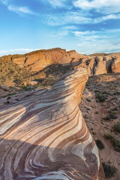 Fire Wave in evening light, rock formation, Sleeping Lizard behind, Valley of Fire State Park, Nevada, USA