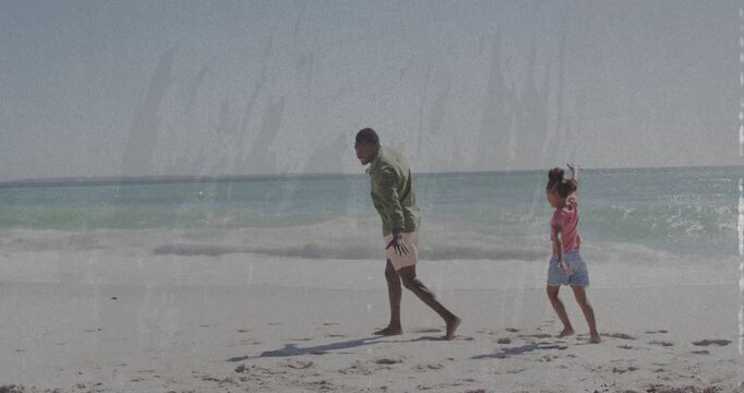 Man initiating playful hops on sandy beach, girl mirroring steps building balance in health