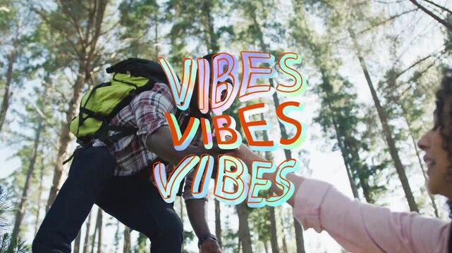 Vertical video: Leaning man in plaid shirt reaching pulling woman up in pine forest VIBES overlay
