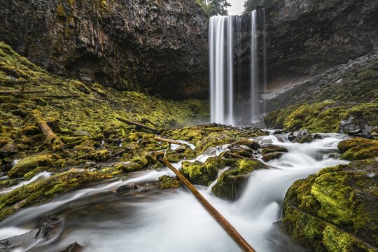Waterfall plunges over rocky outcrop, Tamanawas Falls, time exposure, wild river Cold Spring Creek, Oregon, USA